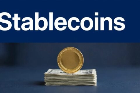 A gold coin balances on dollar bills beneath a navy Stablecoins headline.